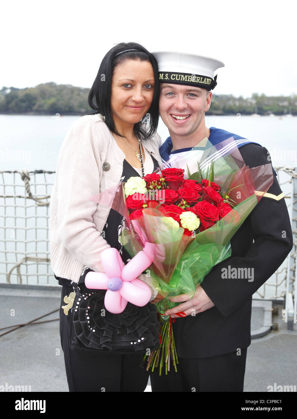 A sailor proposes to his girlfriend on his return to port in Devonport, UK. Stock Photo