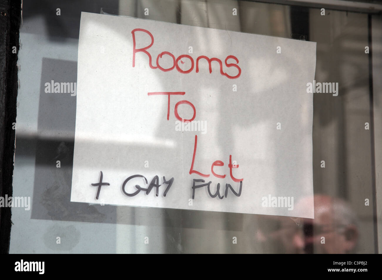 Rooms to let and Gay Fun sign Stock Photo