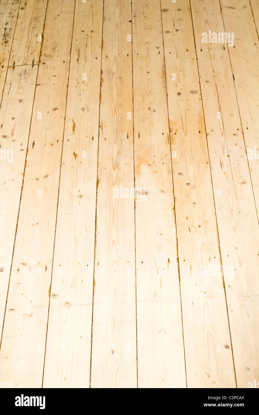 New wood floor. Recently stripped and sanded old pine floorboards giving a new wooden flooring Stock Photo