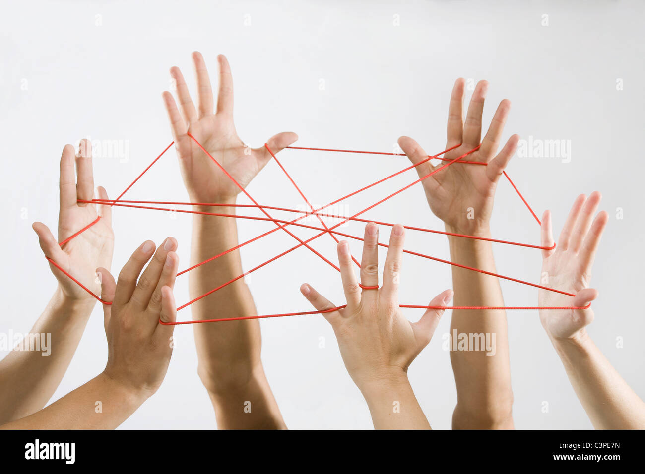 People playing cat's cradle Stock Photo Alamy