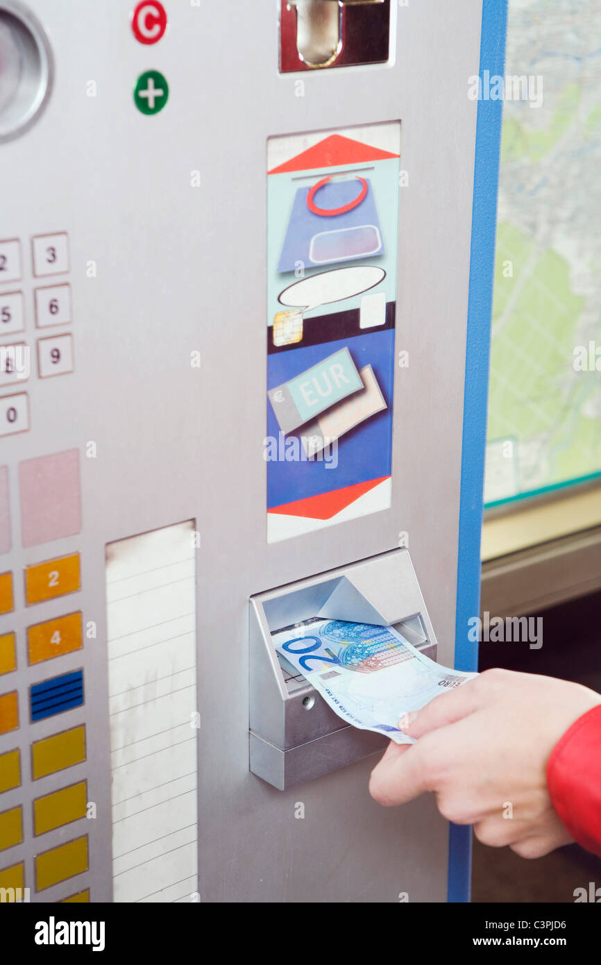 Germany, Bavaria, Munich, Person at ticket machine in subway station Stock Photo