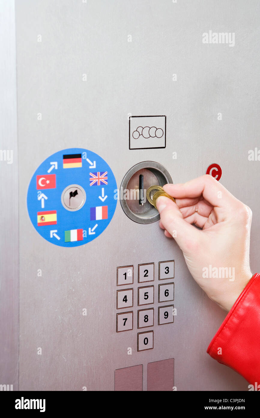 Germany, Bavaria, Munich, Person at ticket machine in subway station Stock Photo