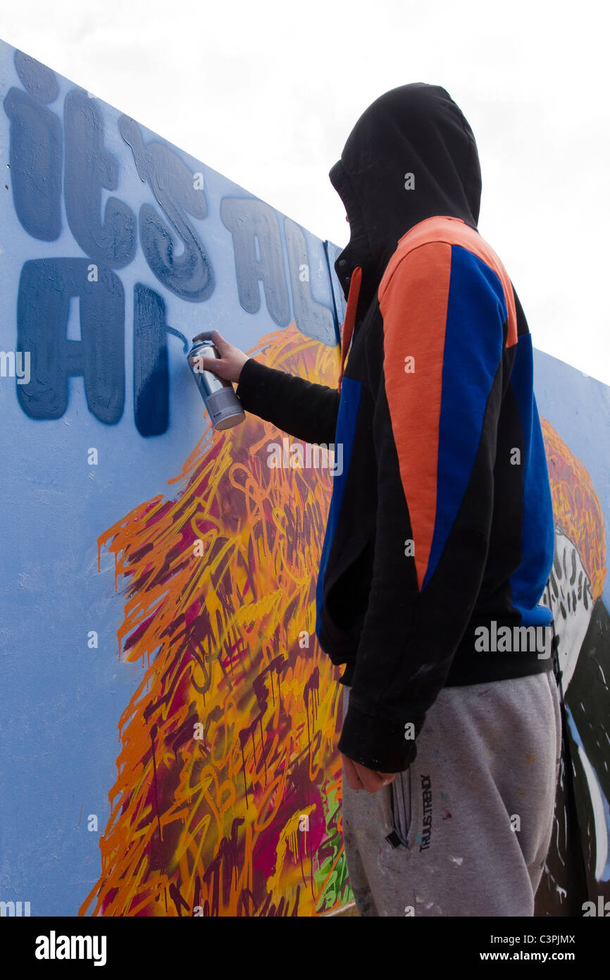 Creating Design   Designing Graffiti Artist at work at the Southport Jam Legal Wall  UpNorthFest Merseyside, UK Stock Photo