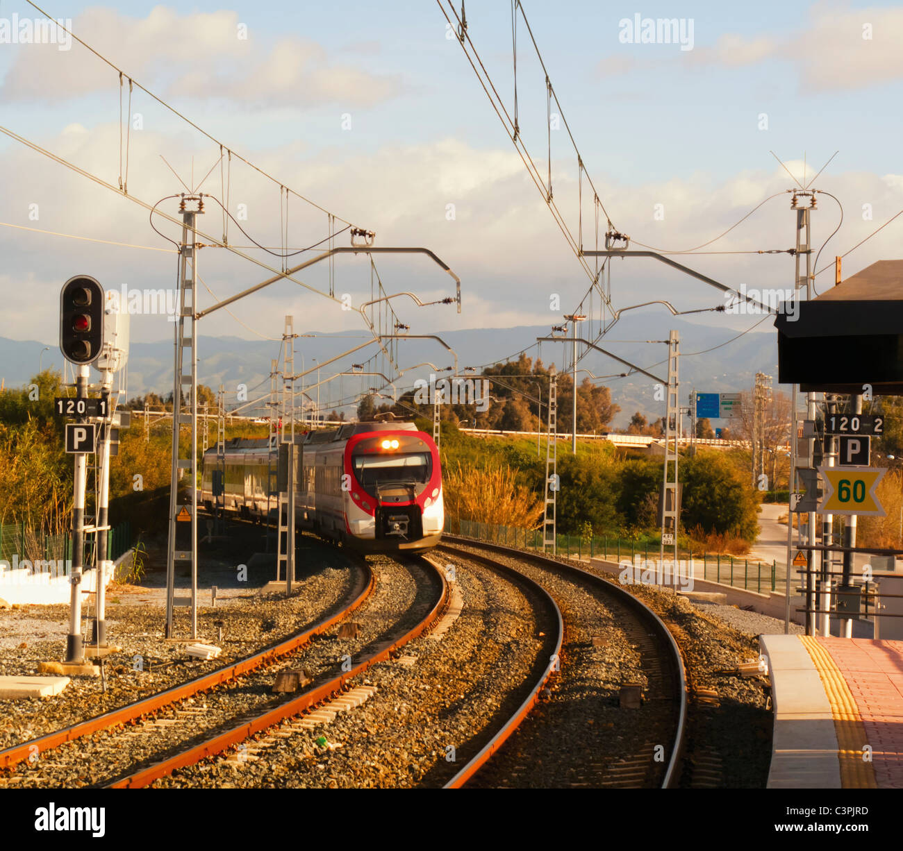 Suburban train approaching Los Alamos station, Torremolinos, Costa del Sol, Spain. Stock Photo