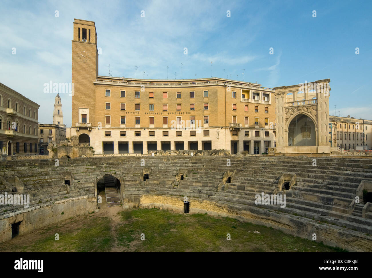 Roman Amphitheatre and INA Building (Italian Rationalist-Fascist Architecture), Sant'Oronzo Square, Lecce, Apulia, Italy Stock Photo