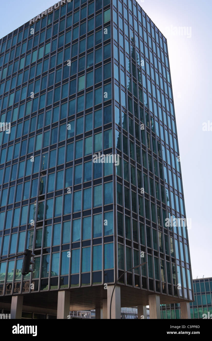 Towers of the St. Nikolai and St. Petri church reflected in modern glass building in Hamburg, Germany, Europe Stock Photo