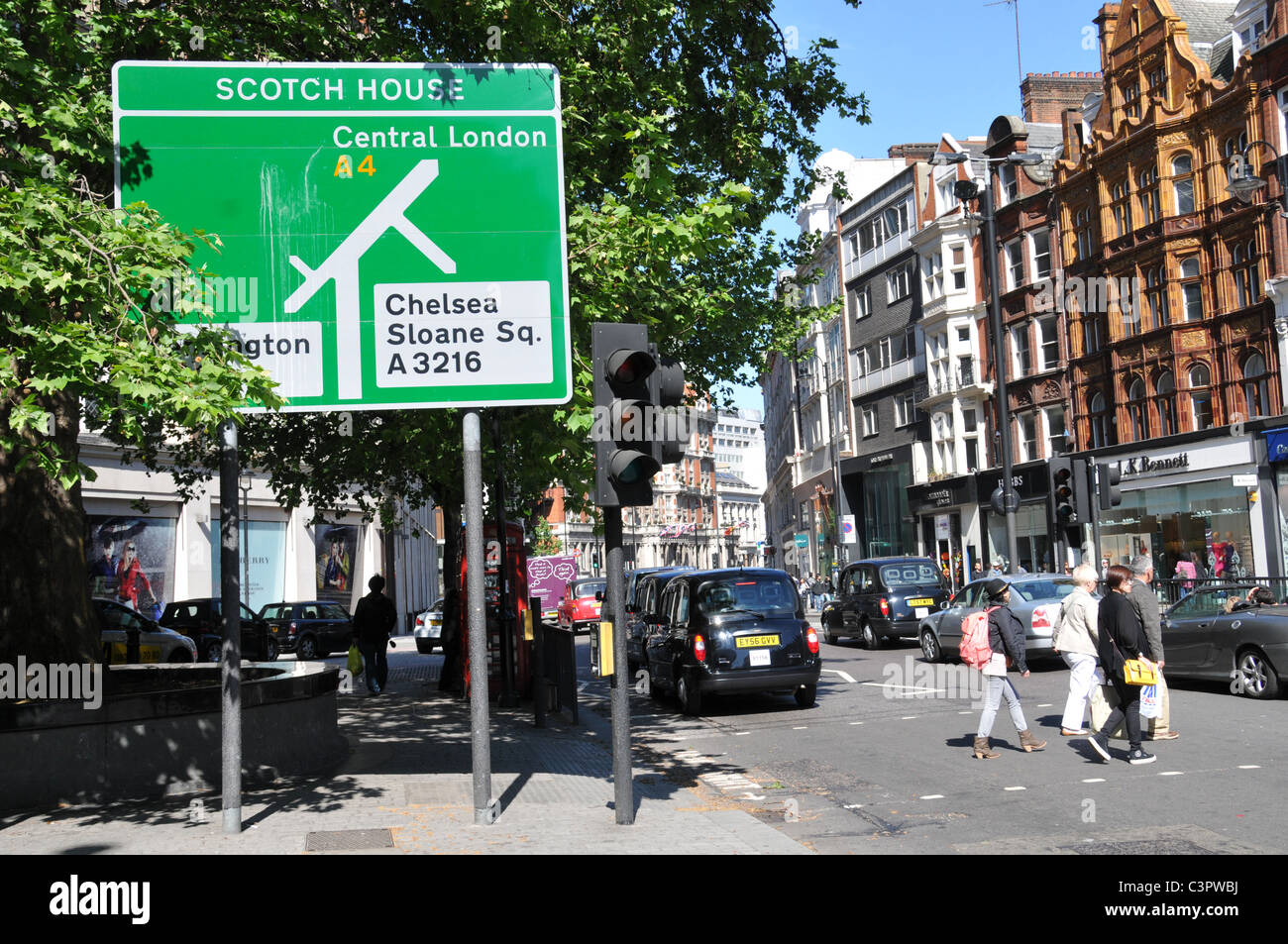 Scotch House street sign Knightsbridge Central London chelsea sloane square street sign traffic taxis Stock Photo