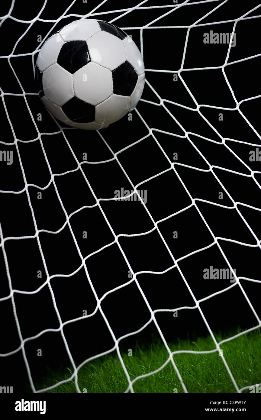 Football striking on net, close up Stock Photo - Alamy