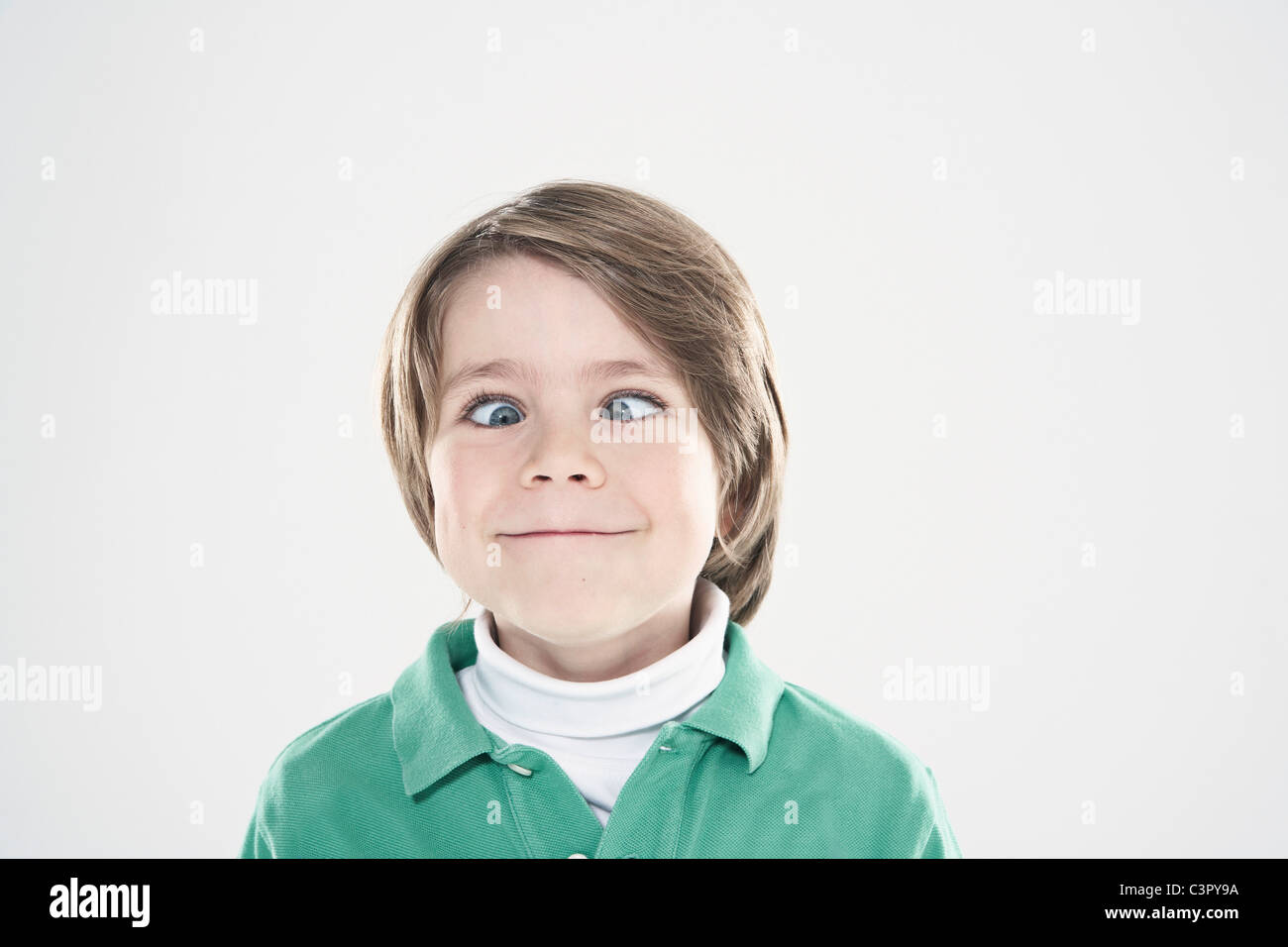 Crosseyed boy (89), closeup, portrait Stock Photo Alamy