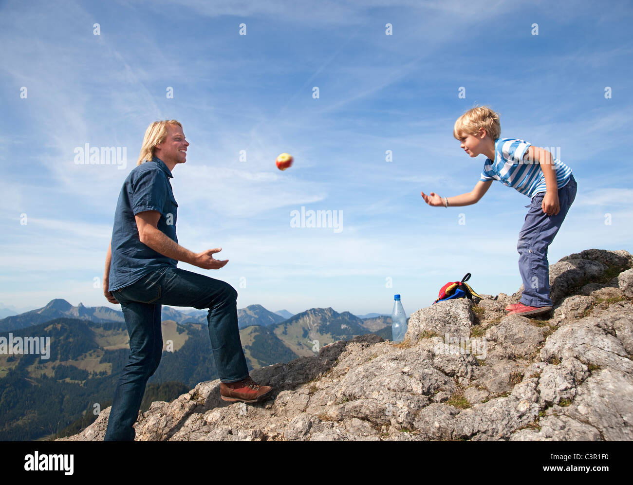 Germany, Bavaria, Father and son (4-5 Years) playing on mountain summit Stock Photo