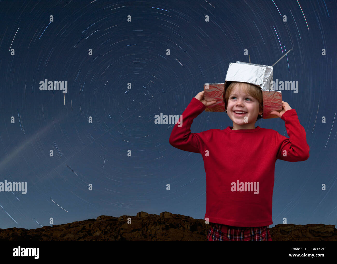 Croatia,Boy with space hat and star trail in the sky Stock Photo