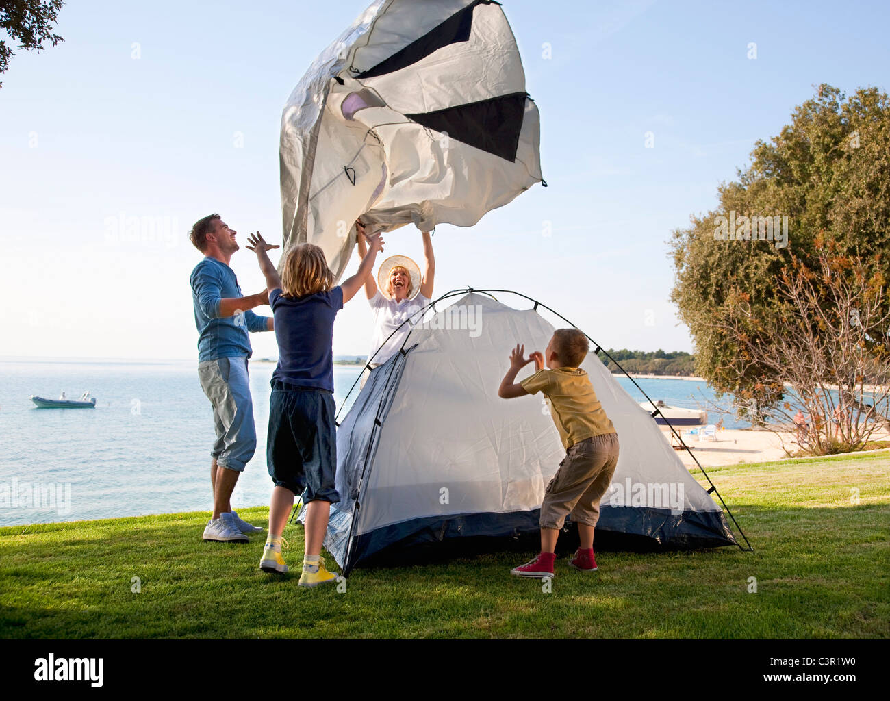 Croatia Zadar Family Putting Up Tent At Beach Stock Photo Alamy