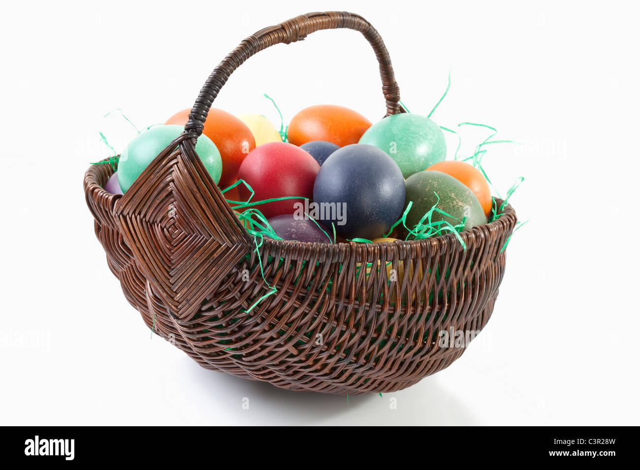 Variety of easter eggs in basket on white background Stock Photo - Alamy