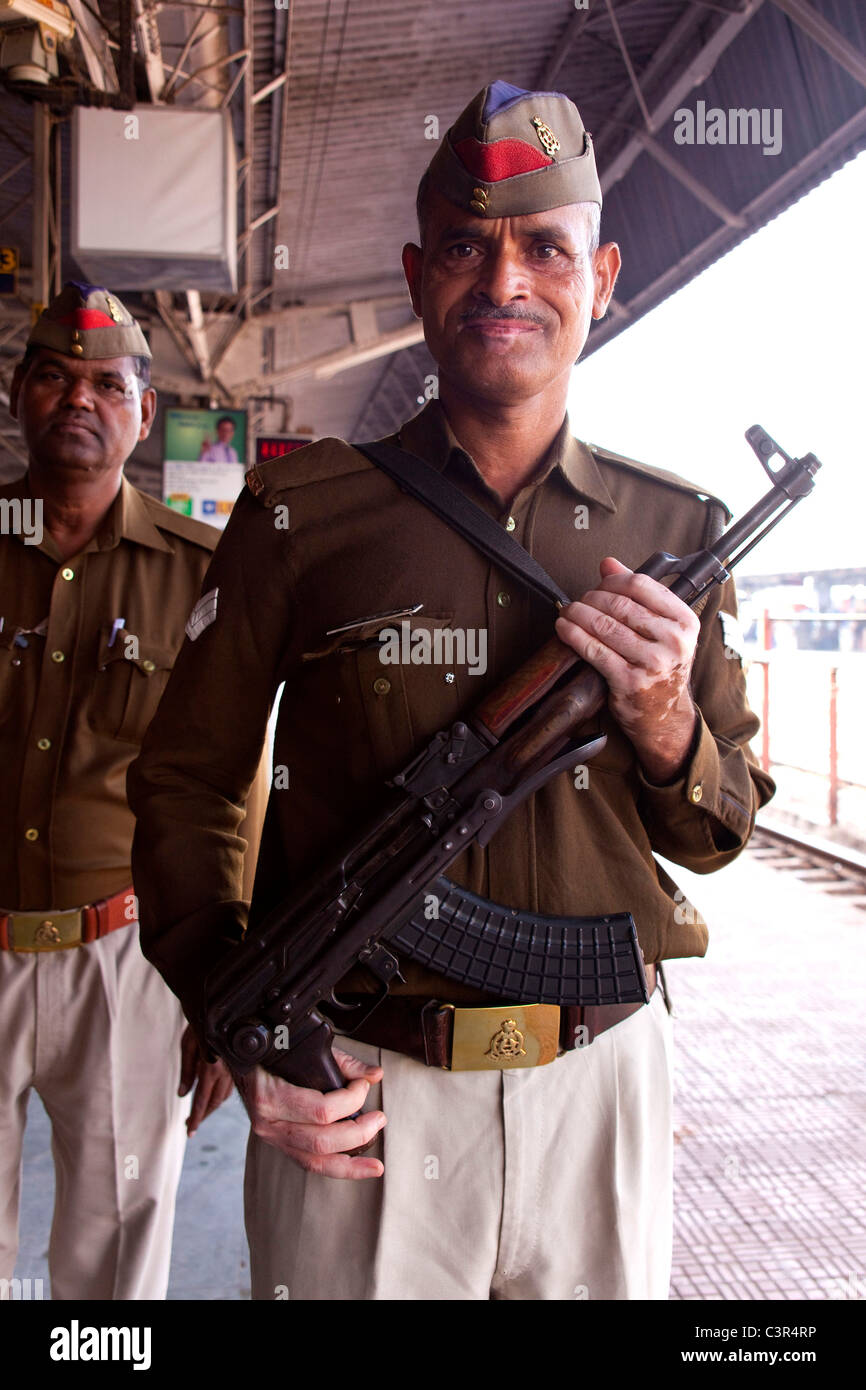 Police officer with ak-47 rifle, Agra, Uttar Pradesh, India, Asia Stock Photo