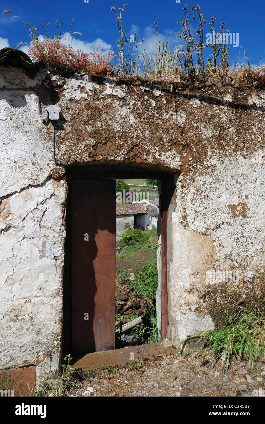 A rustic doorway leading to a farm in Fuentes de León, in the province of Badajoz, Extremadura, Spain. Stock Photo