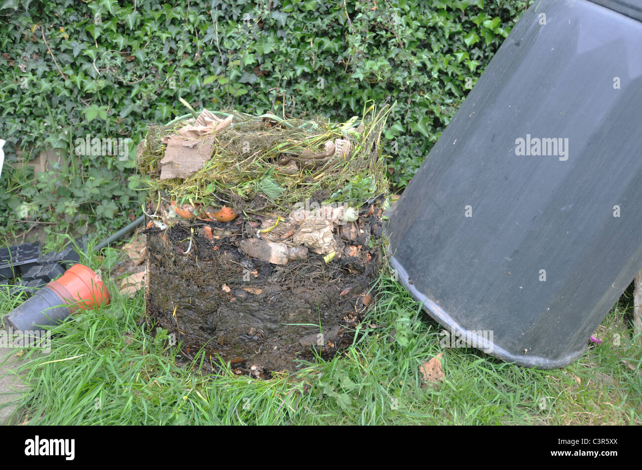 A compost bin removed to show the layers of decomposing material Stock Photo