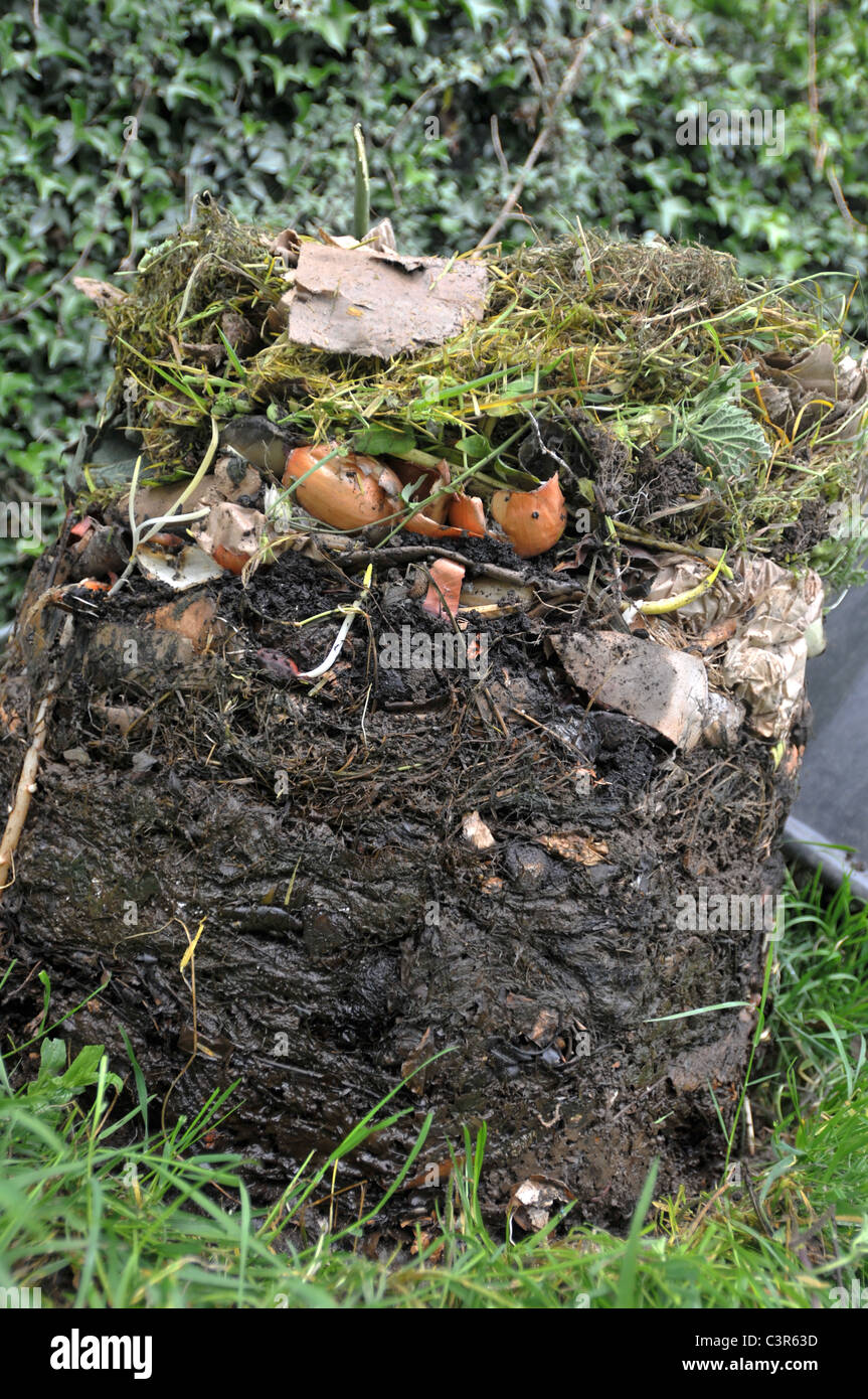 A compost bin removed to show the layers of decomposing material Stock Photo