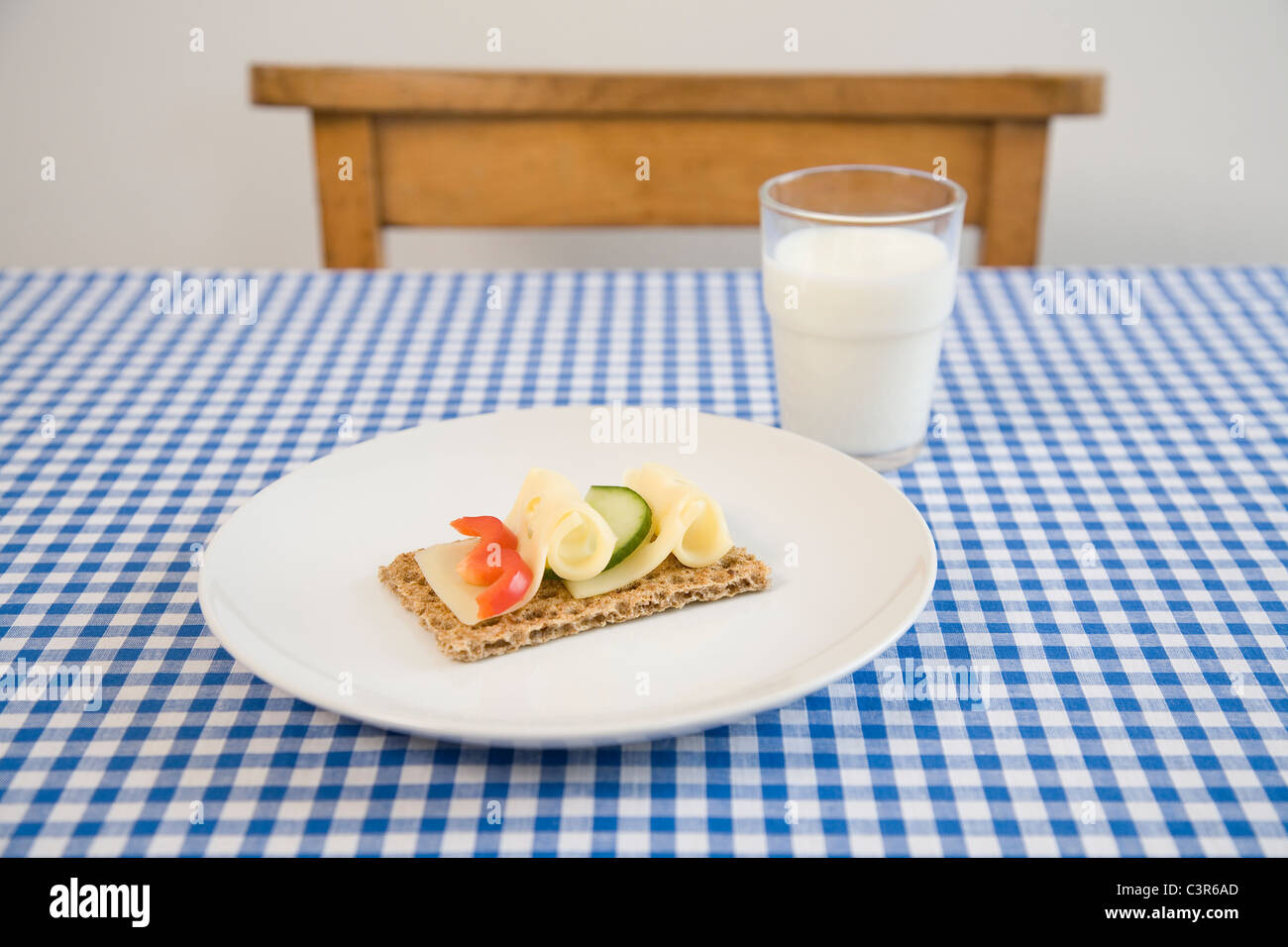 Crisp bread with cheese, glass of milk Stock Photo