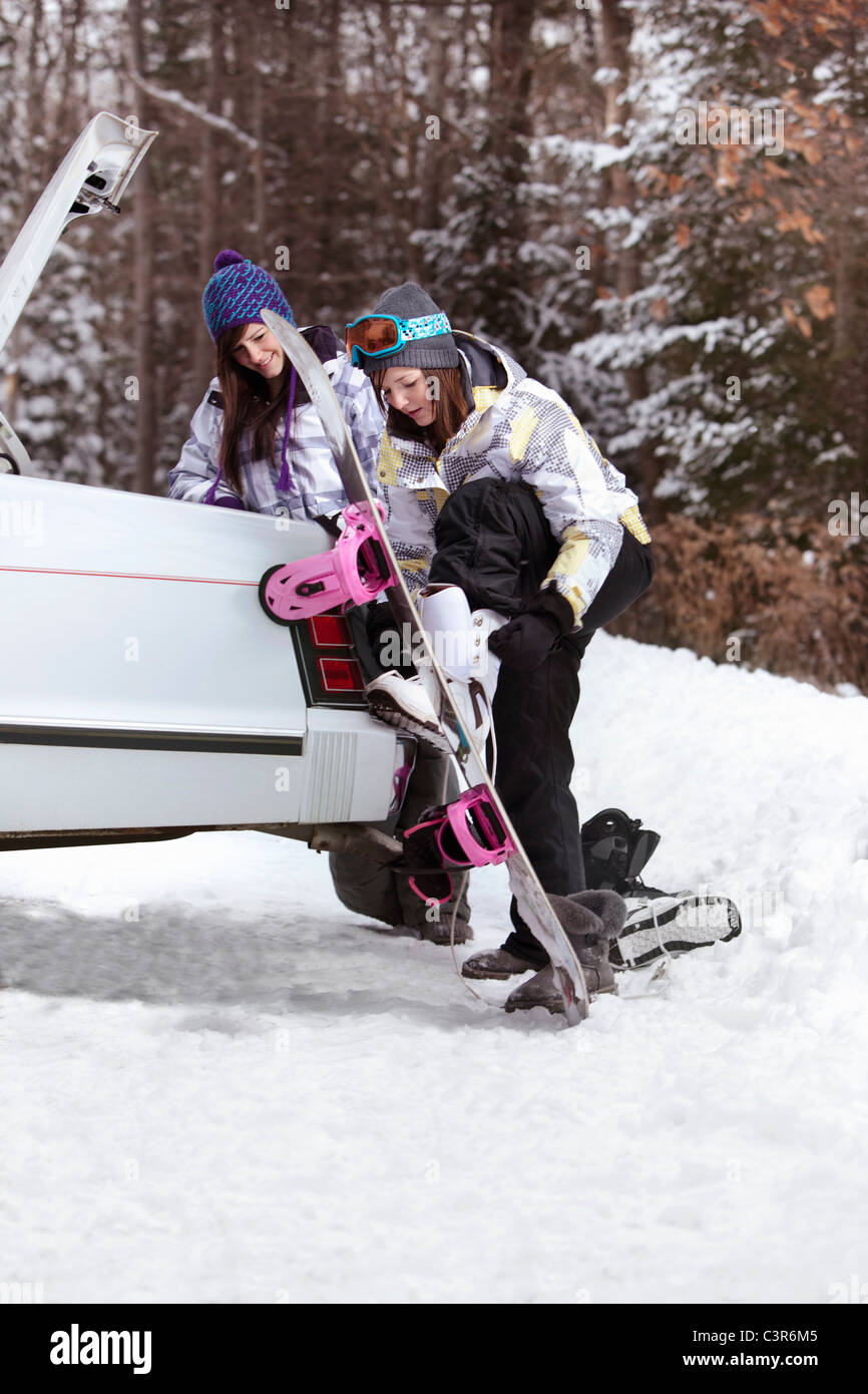 Teen girls going snowboarding Stock Photo Alamy