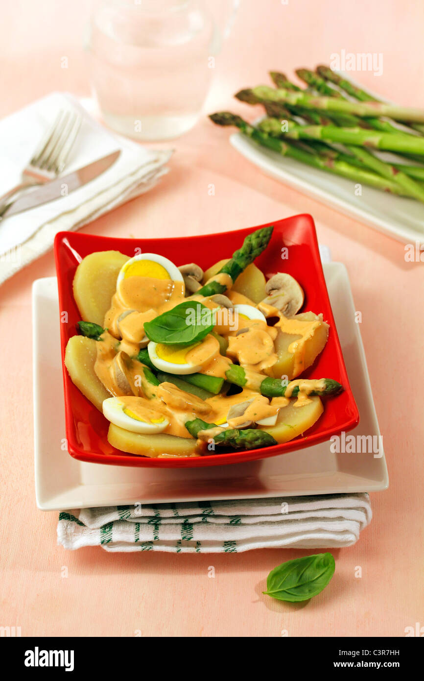 Potato salad with asparagus and mushrooms. Recipe available Stock Photo