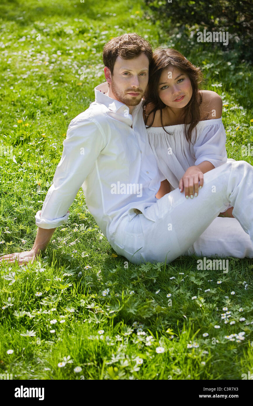 A couple sitting in the park Stock Photo - Alamy