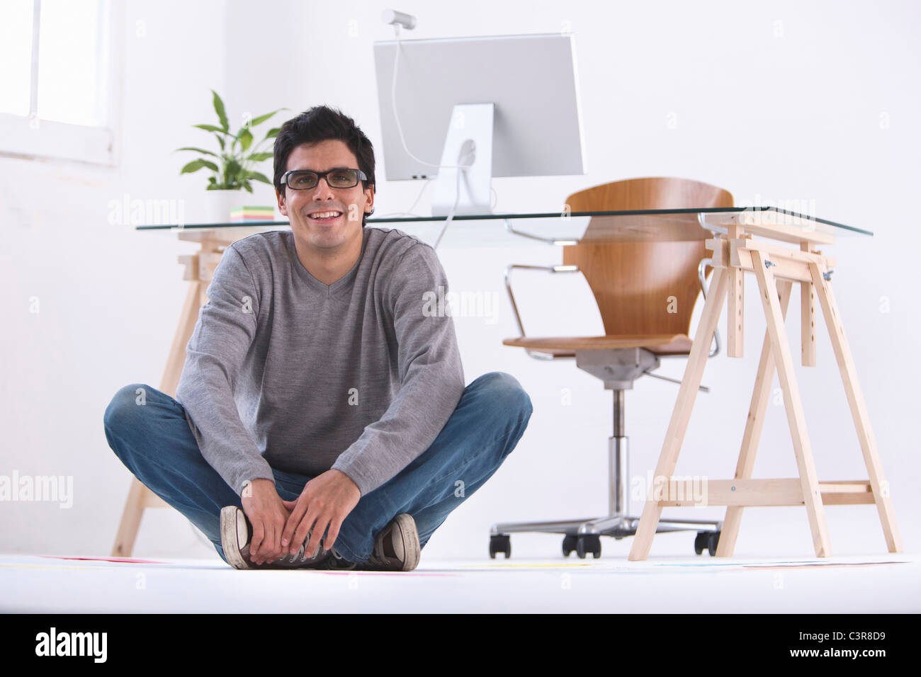 Businessman sitting cross legged on floor hi-res stock photography and ...