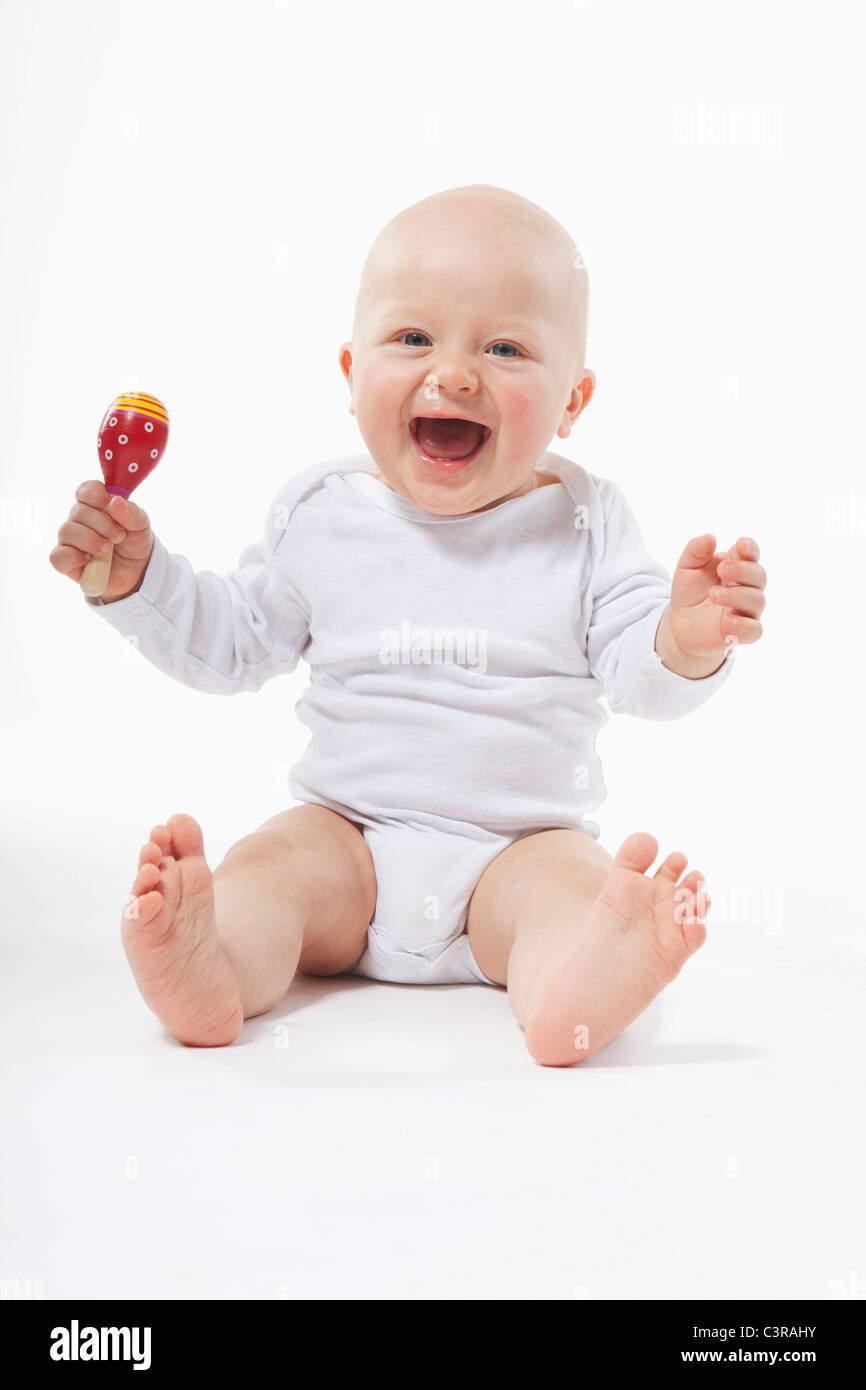 baby holding rattle