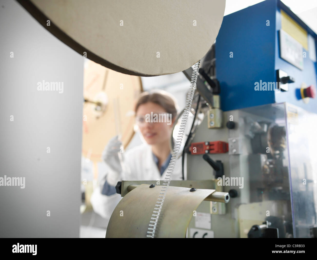 Worker with electronic component machine Stock Photo