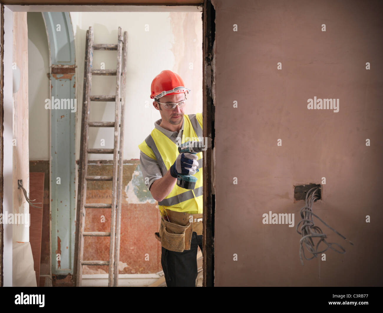 Builder fitting door frame Stock Photo
