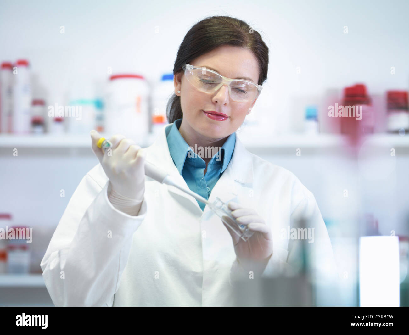 Scientist performing test in lab Stock Photo