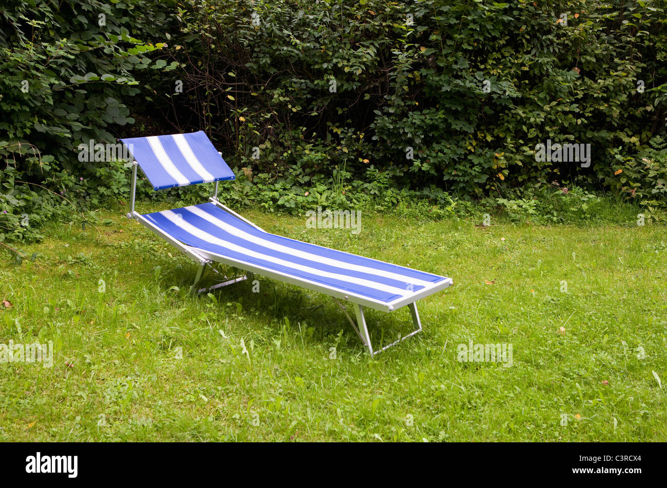 Austria, Land Salzburg, Wallersee, View of beach chair in garden Stock Photo