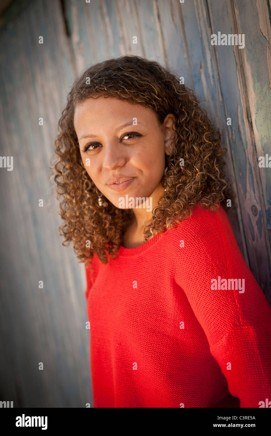 a 20 year old woman wearing red jumper Stock Photo