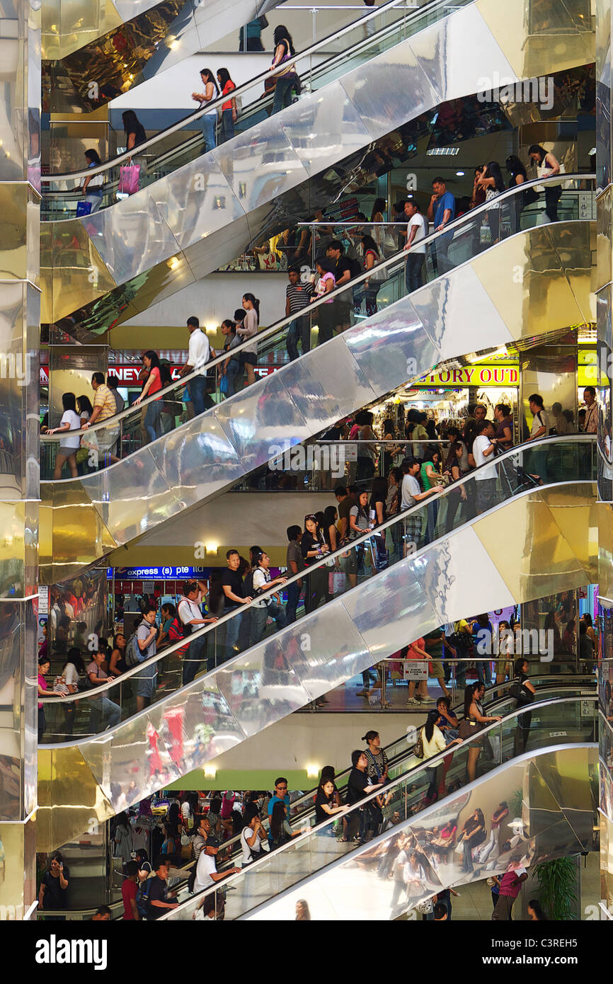 Shoppers in mall in Singapore Stock Photo