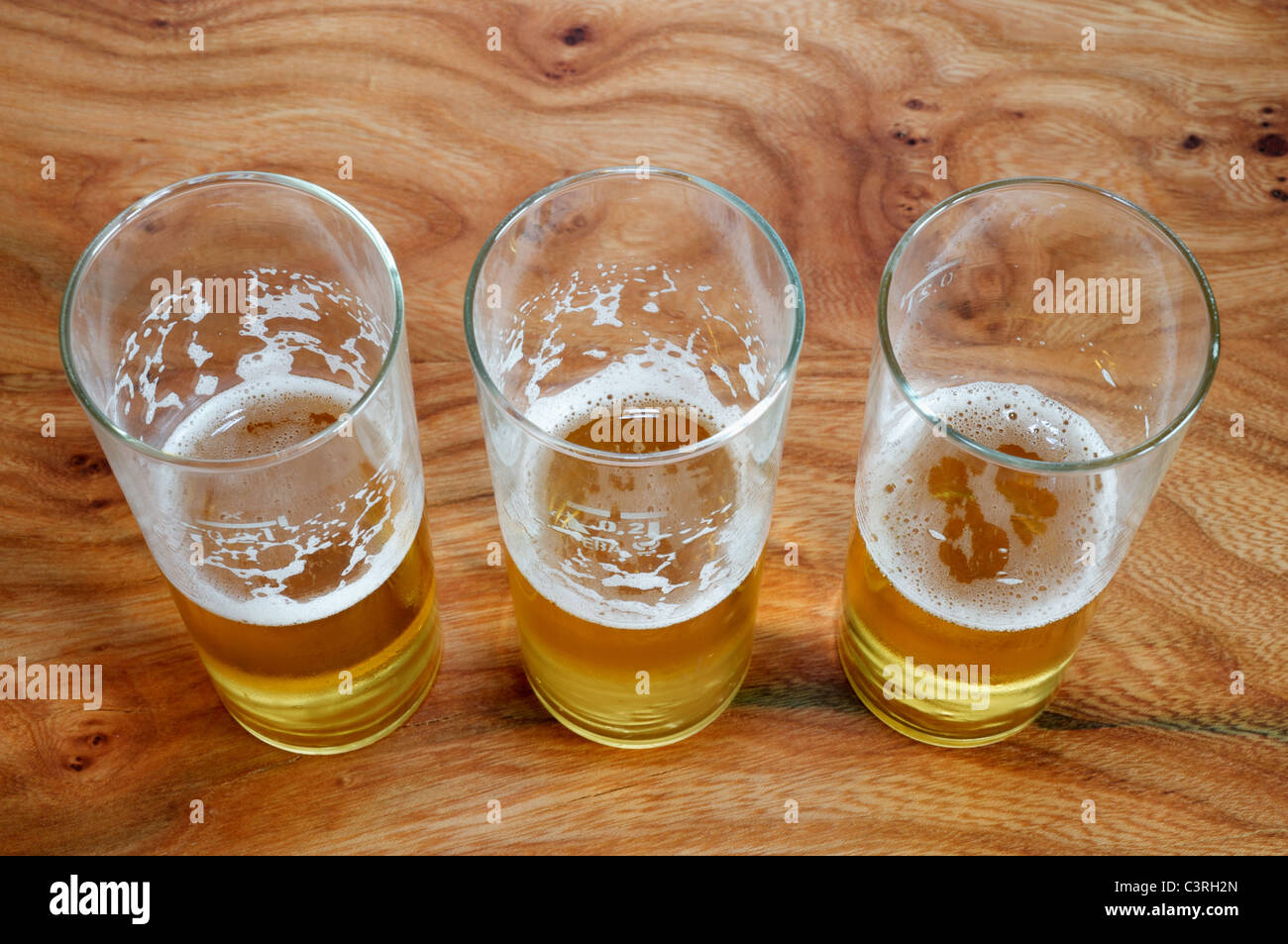 Half-empty beer glasses Stock Photo