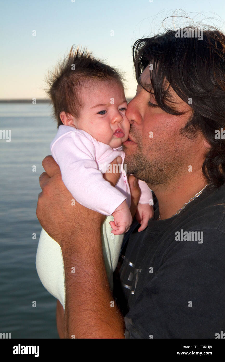Argentine father with new born baby at Necochea, Argentina. Stock Photo