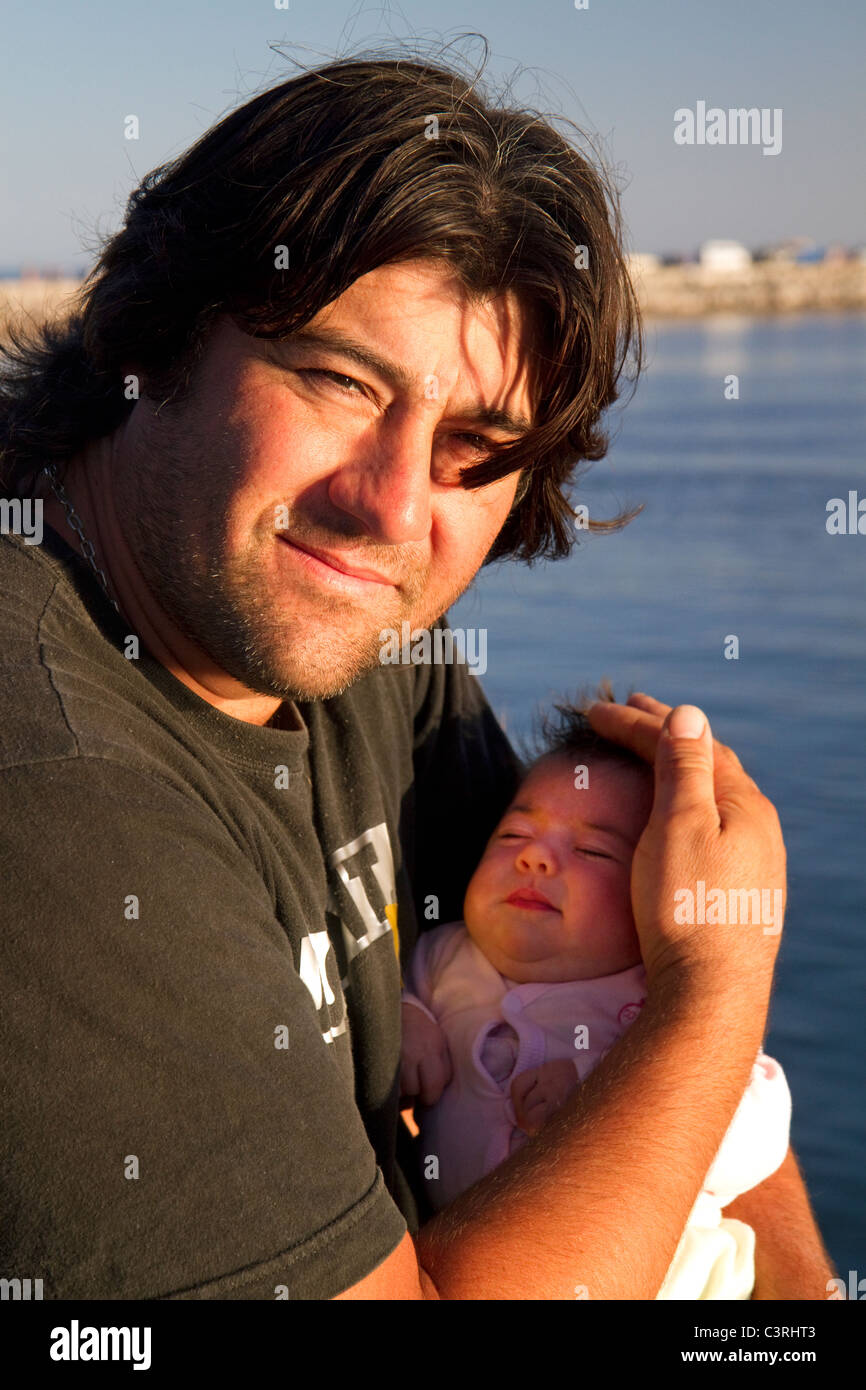 Argentine father with new born baby at Necochea, Argentina. Stock Photo