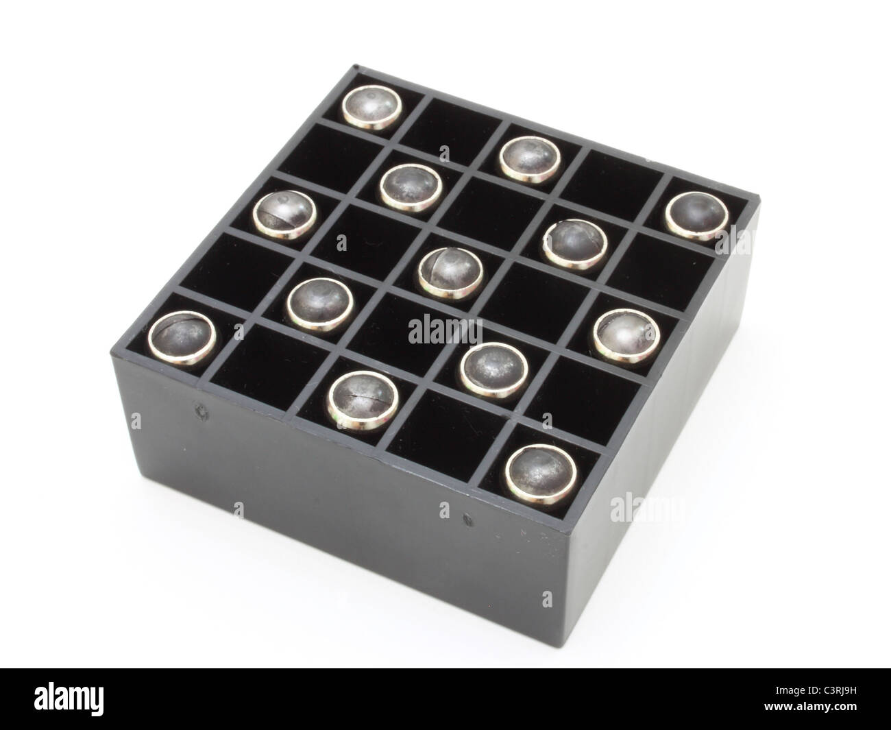 Pistol cartridges with a rubber bullet lie in packing of black color