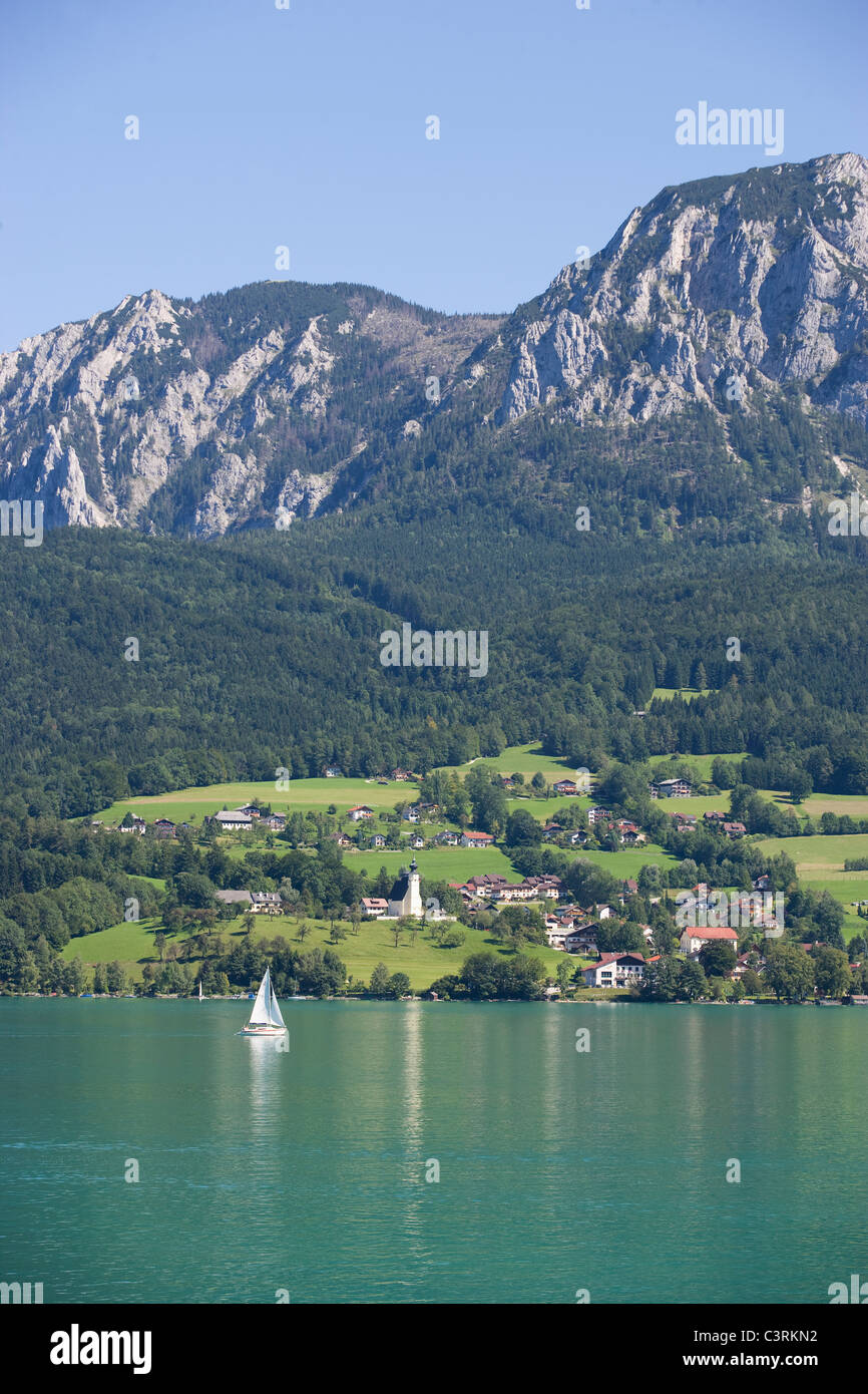 Austria, Salzkammergut, View of steinbach am attersee and attersee lake with hoellen mountains in background Stock Photo
