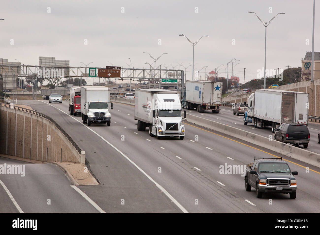 Truck and car traffic on Interstate 35 through downtown Austin Texas USA Stock Photo