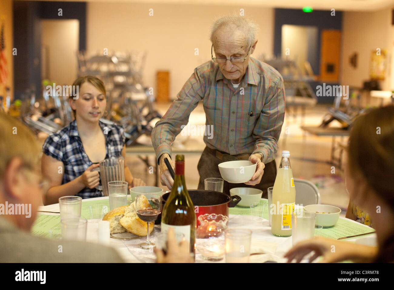 Maundy Thursday observance at St. Martin's Lutheran Church in Austin, Texas, includes simple meal with homemade bread and soup. Stock Photo