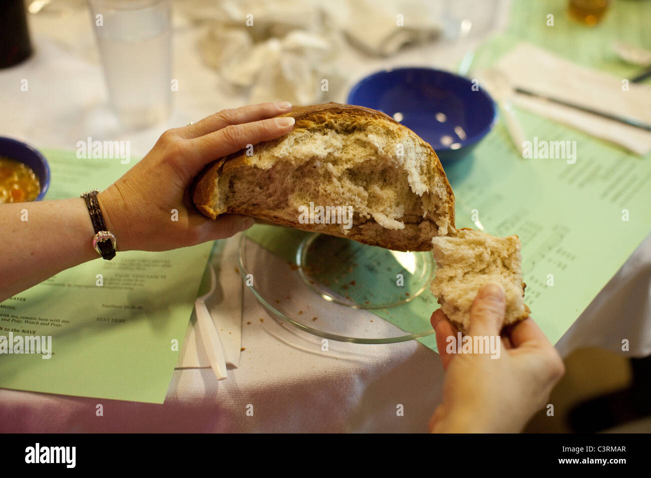 Maundy Thursday observance at St. Martin's Lutheran Church in Austin, Texas, includes simple meal with homemade bread. Stock Photo