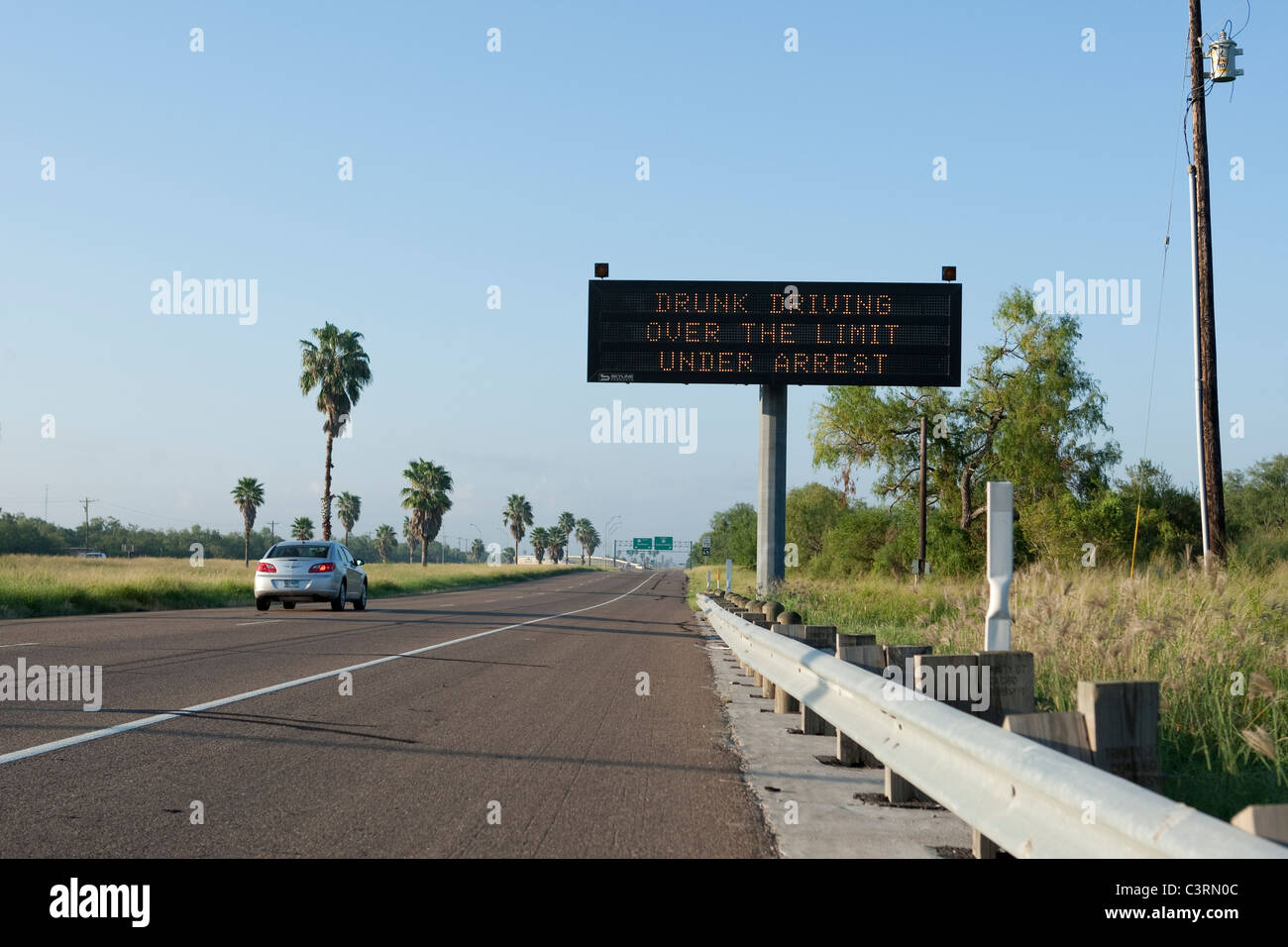 Highway message board on stretch of US Highway 77 in South Texas warns drivers against drunk driving Stock Photo