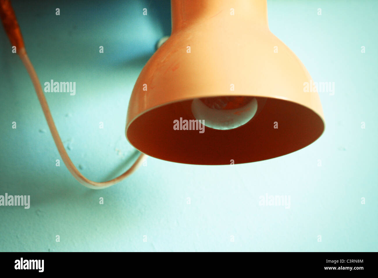 Old lamp on blue wall Stock Photo Alamy