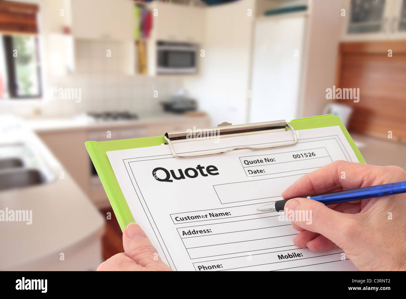 Writing a Quote for Kitchen Renovation Stock Photo