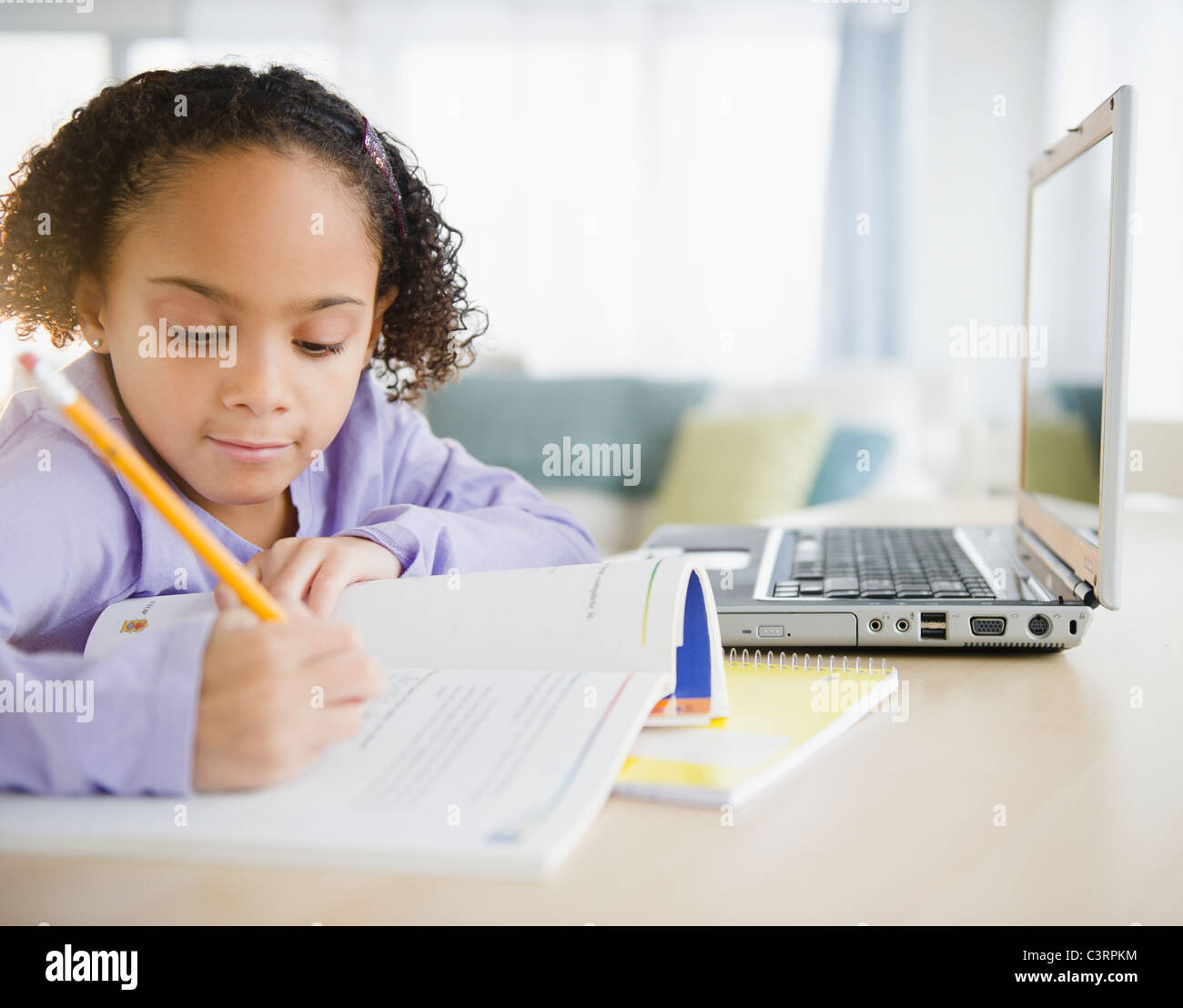 African American girl doing homework Stock Photo