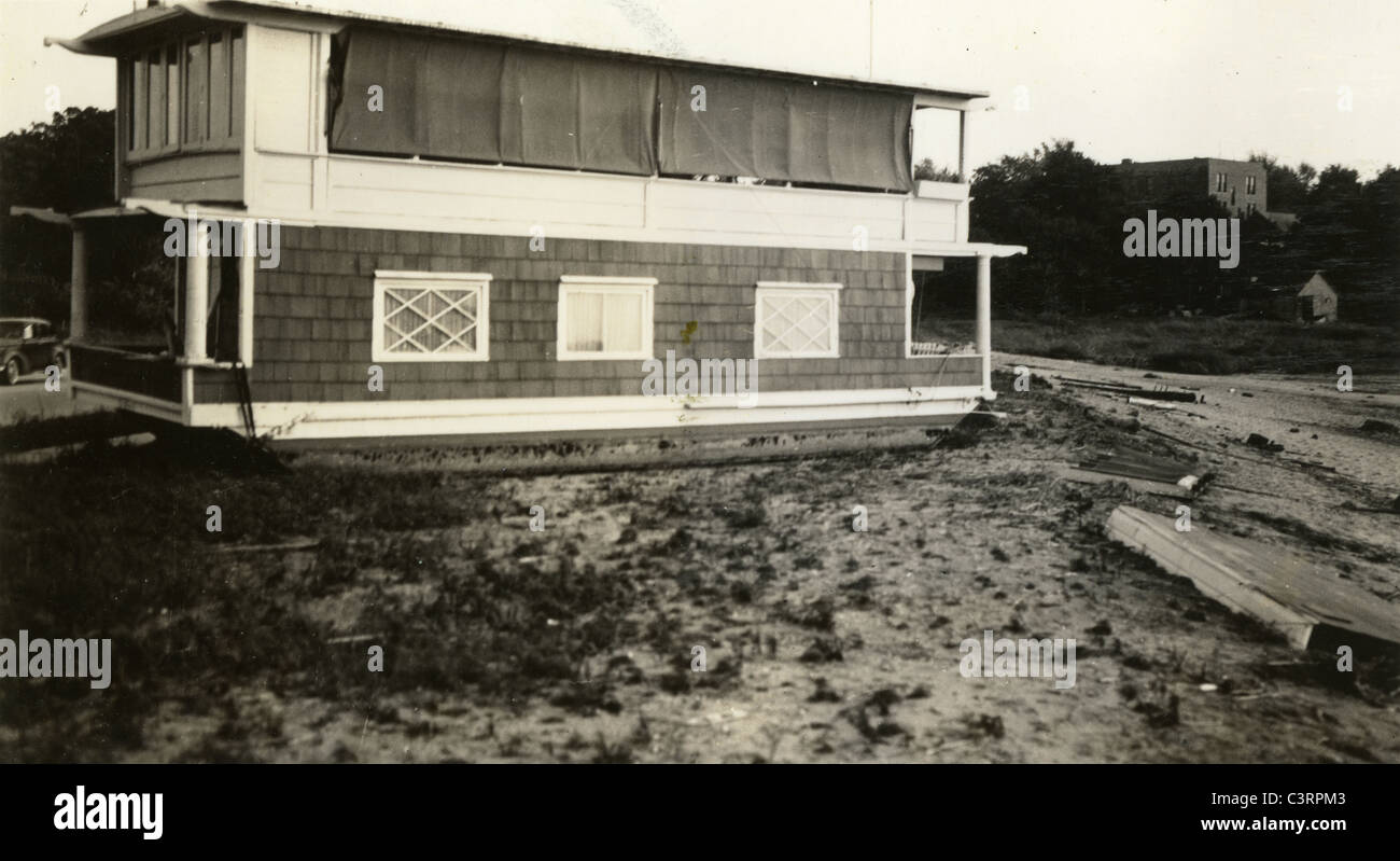 house boat near lake during the 1920s 1930s Stock Photo