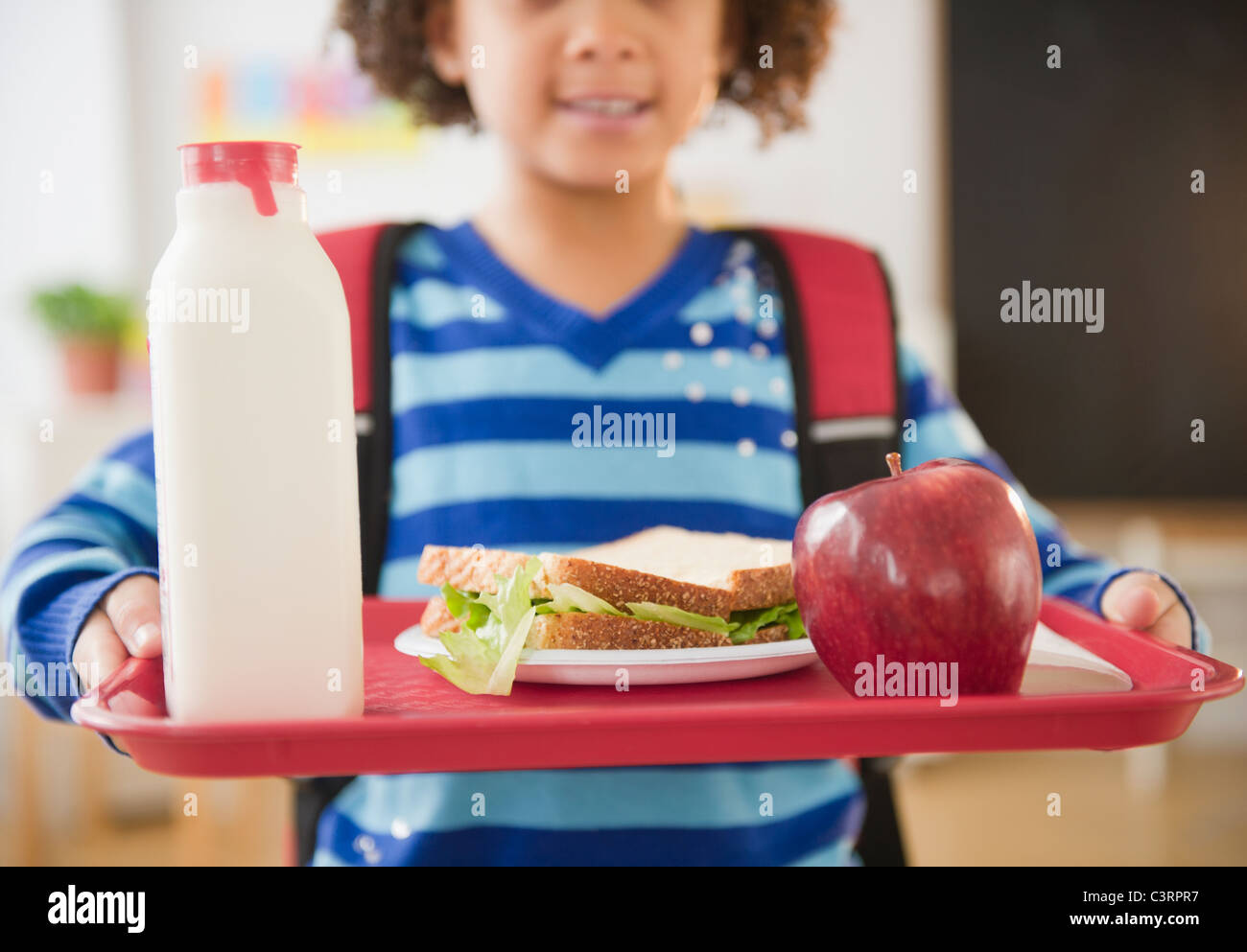 https://c8.alamy.com/comp/C3RPR7/african-american-school-girl-holding-lunch-on-a-tray-C3RPR7.jpg