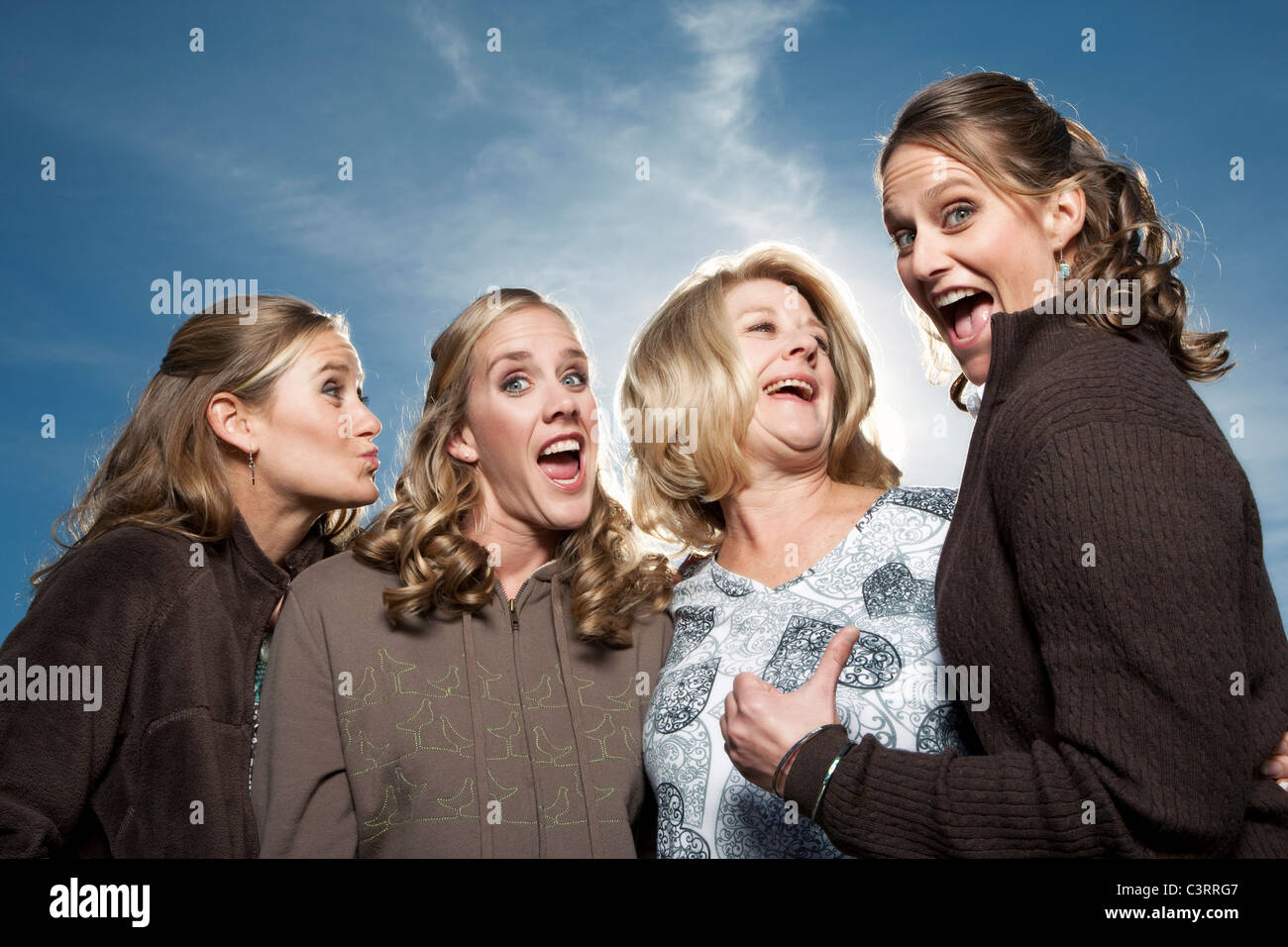 Caucasian mother and daughters laughing together Stock Photo