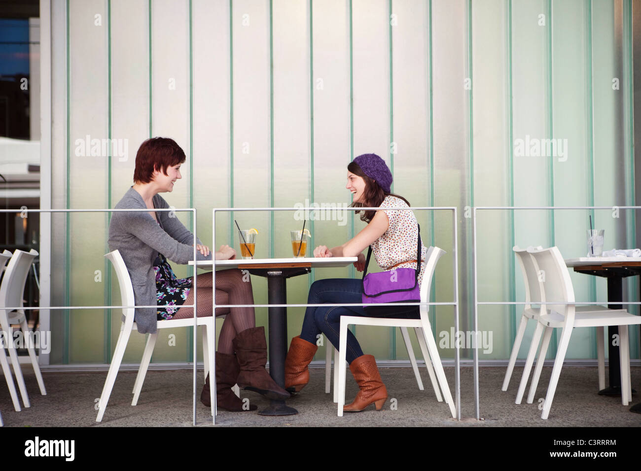 Caucasian friends having lunch in outdoor cafe Stock Photo
