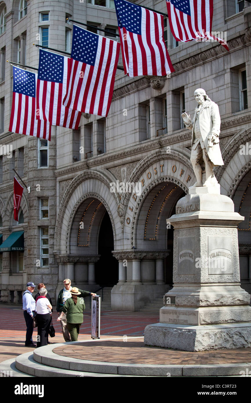 Statue of Benjamin Franklin in front of the Old Post Office Pavilion, Washington DC Stock Photo